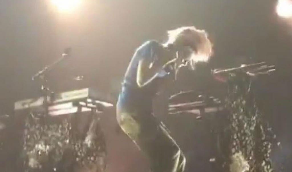 Grimes gets electric shock from her earpieces mid-performance
