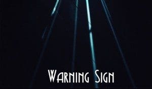 Black Needle Noise returns with 'Warning Sign' track featuring Kendra Frost